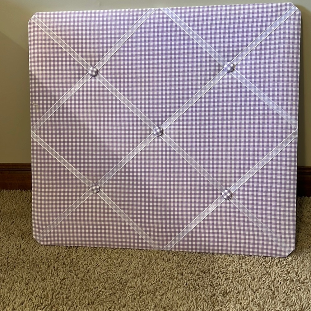 Picture holder. Lilac. Plaid with white ribbon. Goes on wall. Holds lots of pics